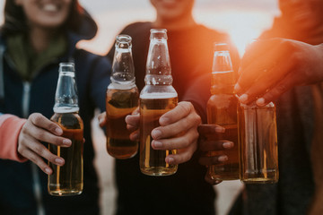 Friends drinking by the beach