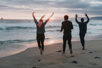 Playful friends on the beach