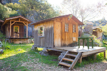 Small wooden houses at a climbing camp.