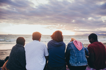 Friends hanging out on the beach
