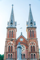 Fototapeta na wymiar Saigon Notre-Dame Cathedral Basilica (Basilica of Our Lady of The Immaculate Conception) on blue sky background in Ho Chi Minh city, Vietnam. Ho Chi Minh is a popular tourist destination of Asia.