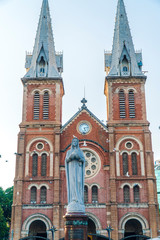 Fototapeta premium Saigon Notre-Dame Cathedral Basilica (Basilica of Our Lady of The Immaculate Conception) on blue sky background in Ho Chi Minh city, Vietnam. Ho Chi Minh is a popular tourist destination of Asia.