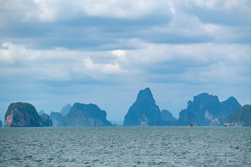 Beautiful landscape of limestone islands and emerald color water in Phang-Nga bay national park near Phuuket Thailand.