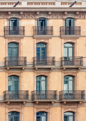 Facade of the house with windows and balconies