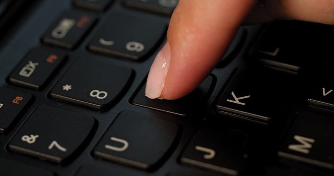Pushing I button on the black keyboard. English letters. Used Macro lens and slow-mo.