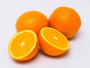 Fresh and tasty oranges with white background