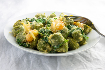 Creamy cheesy sauce spinach gnocchi with shrimp