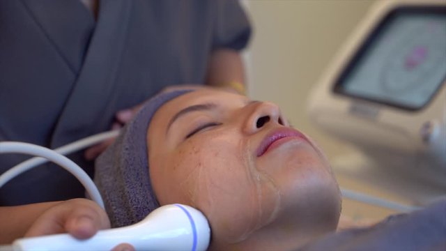 Female receiving Anti-Aging cosmetics using ultrasound cavitation machine.