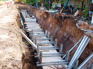 Manhole and concrete drain in the hole Long concrete pipes for the construction of sewerage systems...