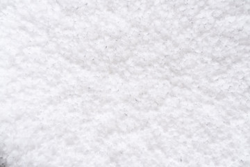 Background of fresh white snow. Winter snowflakes texture. Snow white texture winter background. Icy surface pattern. Shiny snow with bokeh