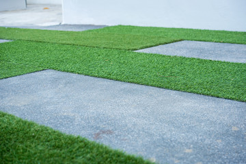 concrete pathway and artificial grass