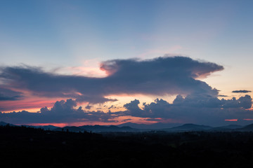 Fototapeta na wymiar Colorful sunset over the mountain hills