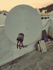 Satellite dish and TV antennas on the roof 