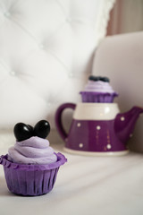 Vintage composition with chocolate cups with berries and a stylish teapot