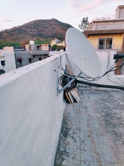 Satellite dish and TV antennas on the roof 
