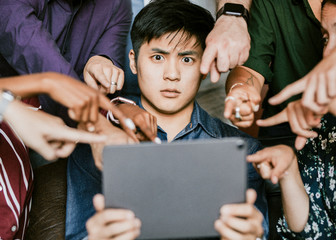 Colleagues streaming a video on a tablet