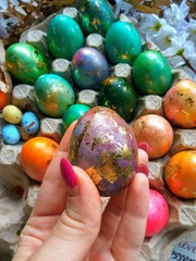 painted easter eggs with green leaves and decor