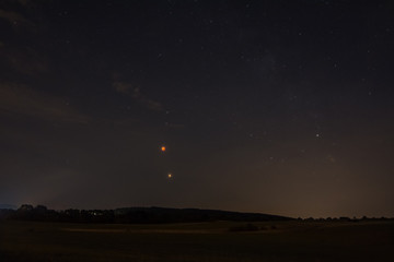 landschaft mit mondfinsternis und einem stern