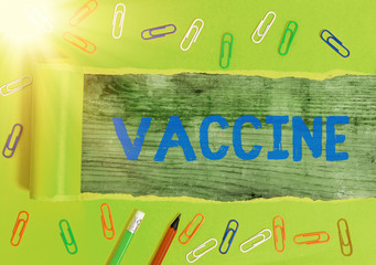 Writing note showing Vaccine. Business concept for preparation of killed microorganisms or living...