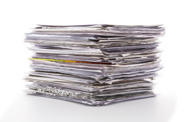 Large pile of waste paper isolated on white