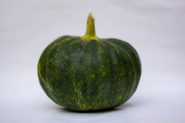 green pumpkin with white background