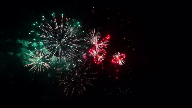 4K real abstract fireworks show on deep black night sky