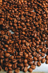 Coffee beans on the rustic background. Selective focus. Shallow depth of field.
