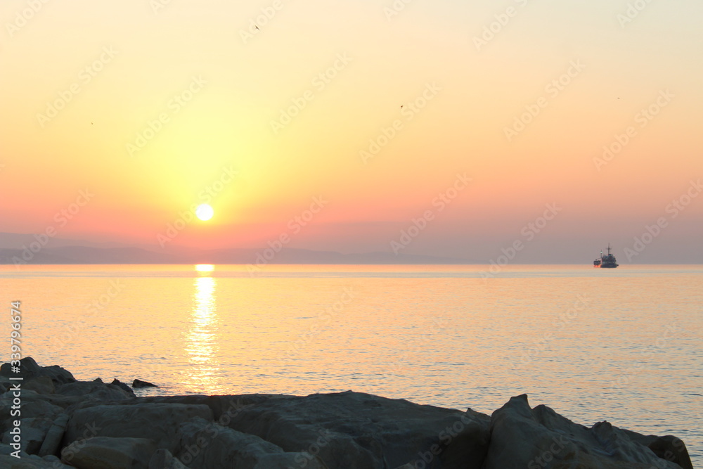 Wall mural sunset over the sea