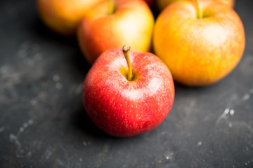Close-up apples on the rustic wooden background. Selective focus. Shallow depth of field.