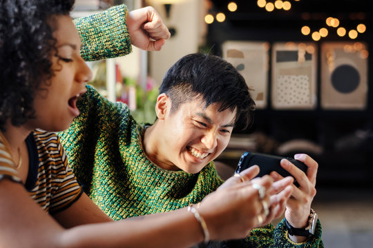 Couple Playing Online Mobile Game