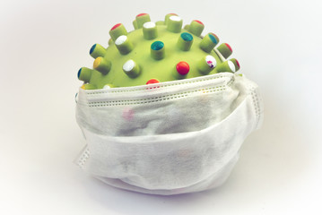 
green virus in a medical mask