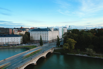 Long exposure of traffic over a bridge at daytime. View onto Pitkäsilta connecting the districts...