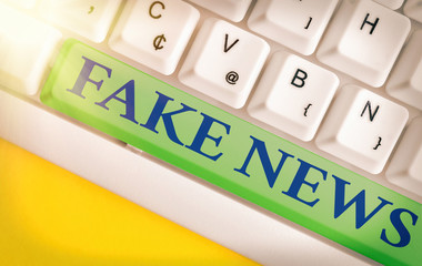 Handwriting text writing Fake News. Conceptual photo false information publish under the guise of...