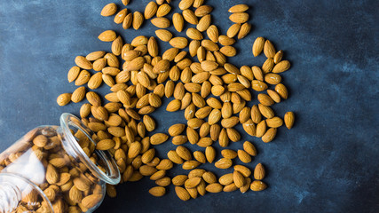 Almonds on a nice blue rustic background. Top view. Copy space. Healthy food concept 