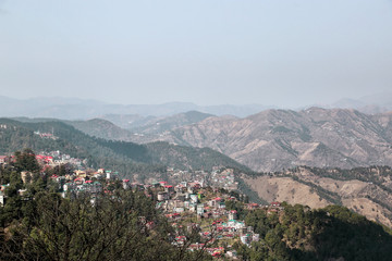 Fototapeta na wymiar Shimla, India - 03/01/2020: View of the upper areas of the city located on the slopes of the Himalayas