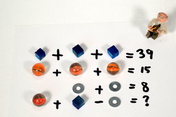 Calculation riddle arrangement with a watching tutor.