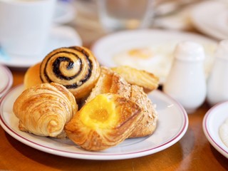 Mini Cinnamon pie  cup of coffee and croissant