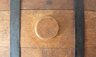 Close-up of an old water barrel, used on an old Frisian boat