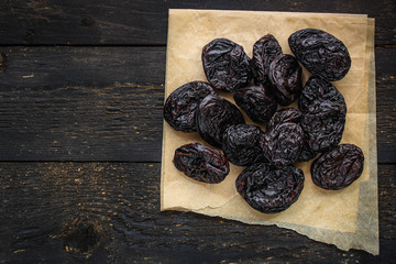prunes, dried plums (tasty and healthy fruits) desiccated keto or paleo diet
menu concept. background. top view. copy space for text