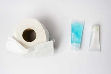 Coronavirus corona virus prevention travel surgical masks, hand sanitizer gel and tissue for hand hygiene spread protection.