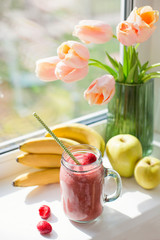 Healthy diet smoothie with strawberry, banana and apples in glass mason jar