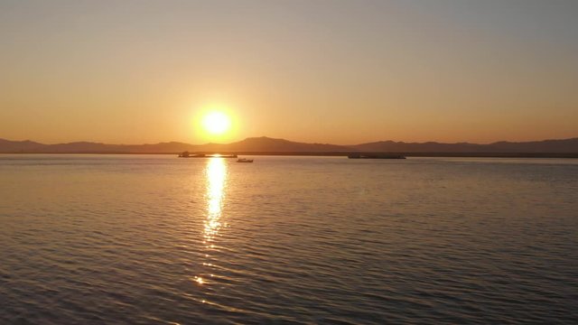 Drone shot of Irrawaddy River towards the sunset, near old Bagan.