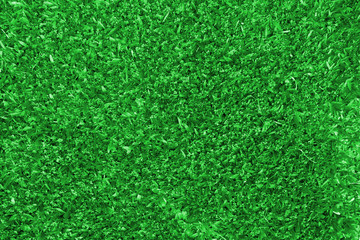 Background of a green grass with sunlight and shadow.
