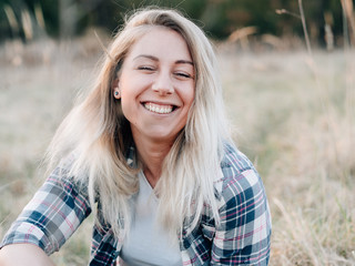 Fototapeta premium Happy woman smiling outddor. Carefree llife.
