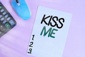 Handwriting text writing Kiss Me. Conceptual photo informally request to touch my lips with your lips or press against Electronic calculator device wire mouse striped sheet colored background