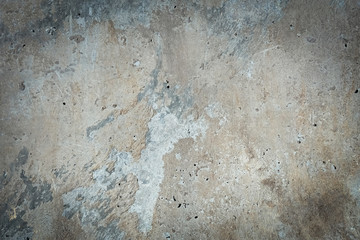 Old concrete wall with stains. Gray vignette background.