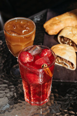 Strawberry drink with ice and cinnamon. Summer cold lemonades, menu.