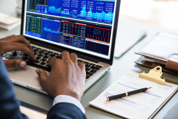 Black businessman using computer laptop