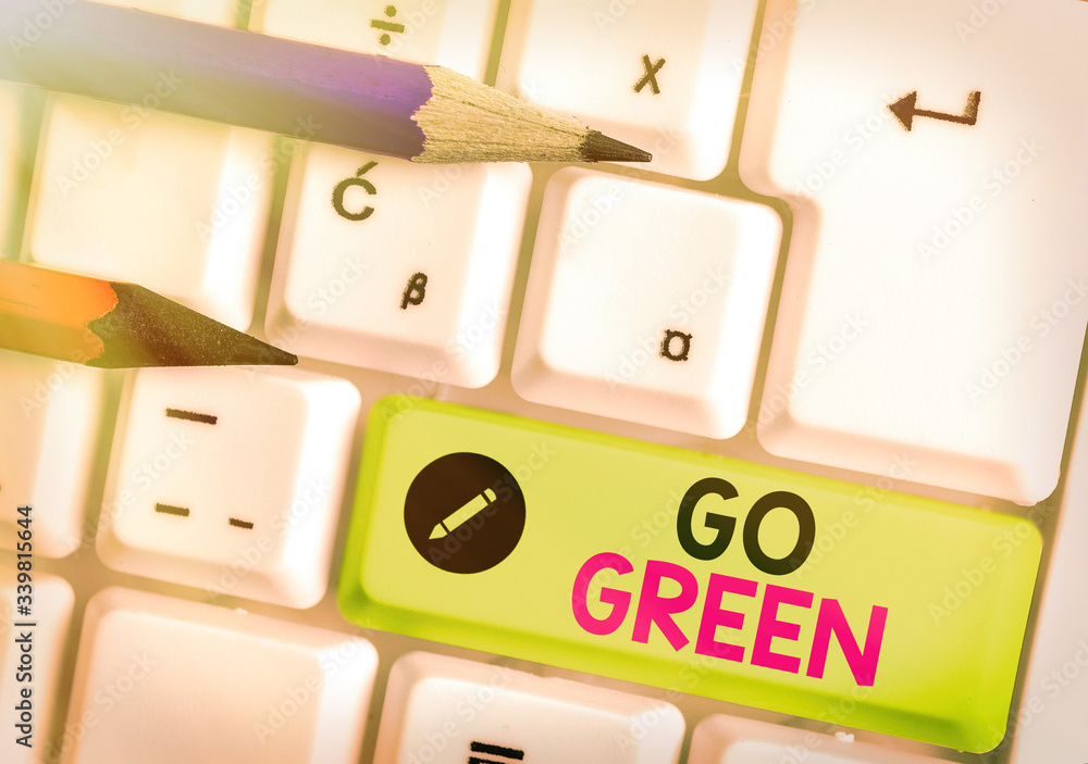 Poster handwriting text go green. conceptual photo making more environmentally friendly decisions as reduce