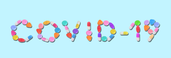 miniature blue drug model arrange in word (covid - 19) on pastel background